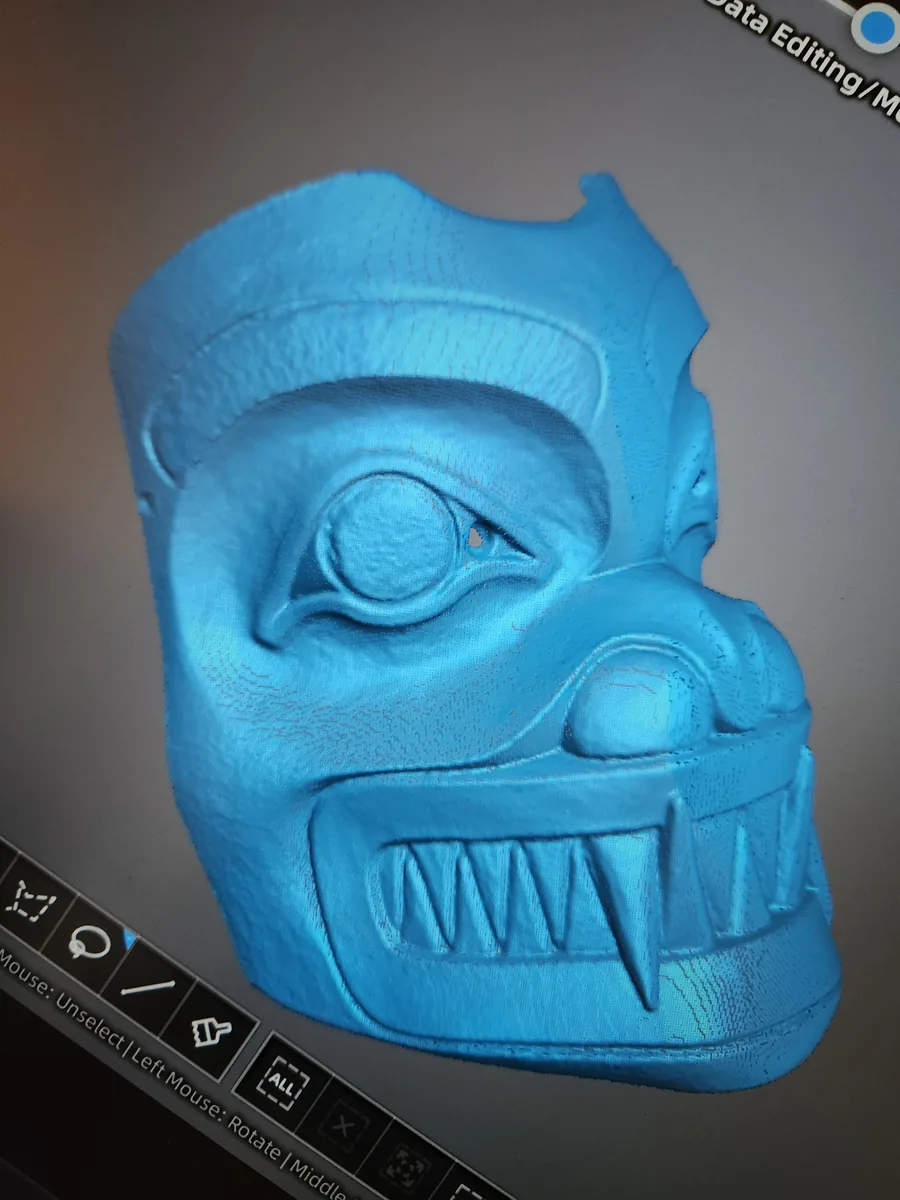Blue 3D scan of the bear mask showing every tooth and tool mark