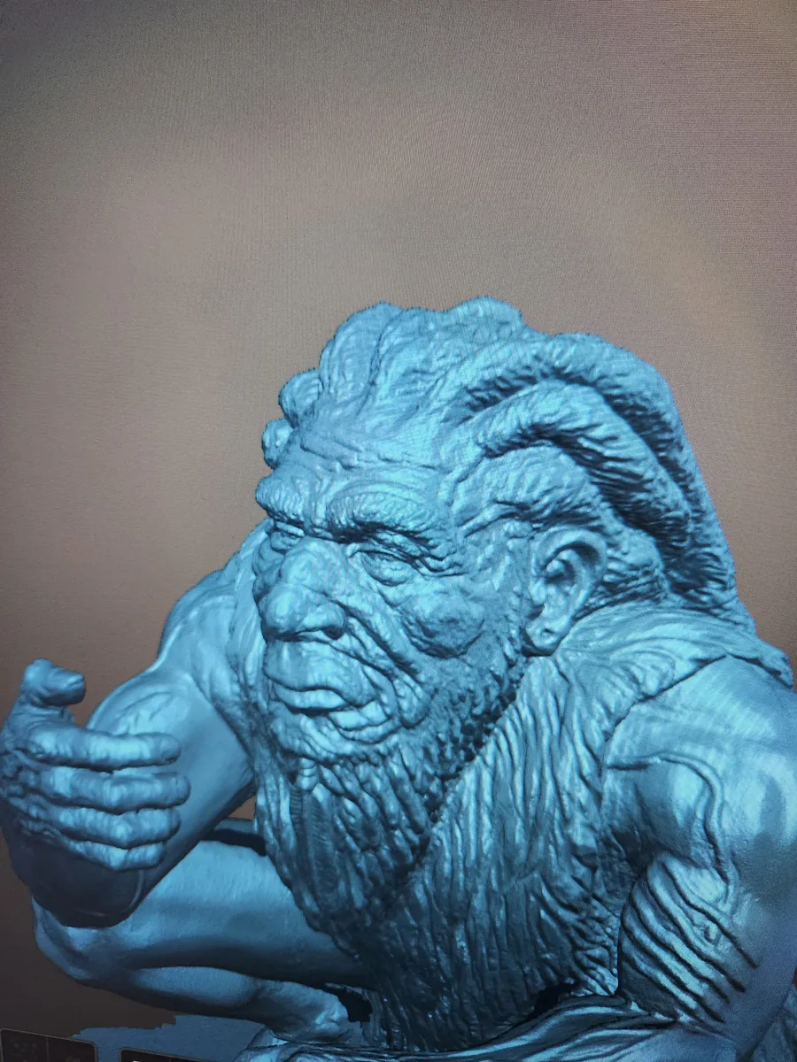 3D scan of the carved caveman sculpture, showing the wood grain and tool marks
